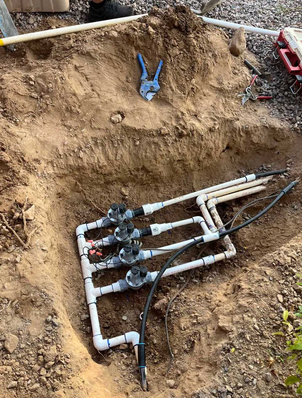 Multi-valve irrigation manifold installed in trench